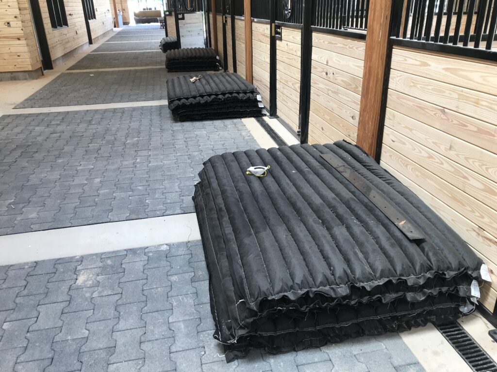 Stall Mattresses outside of a horse stall